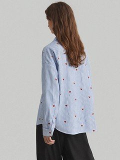 Back view of the blue heart motif striped shirt, showing its silhouette and design details.