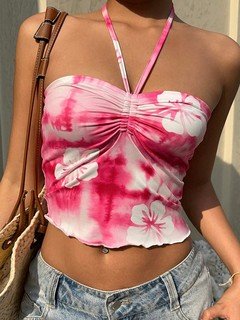 Front view of the pink hibiscus ruched halter crop top, showing its silhouette and design details.