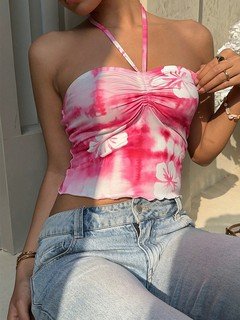 Lifestyle front view of the pink hibiscus ruched halter crop top, showing its silhouette and design details.