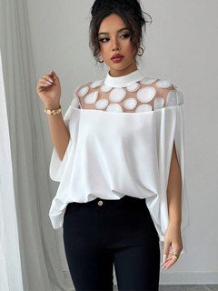 Styled front view of the white circle lace yoke cape blouse, showing its silhouette and design details.