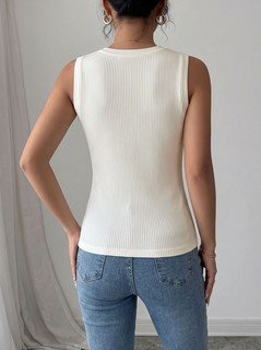 Back view of the ivory high-neck sleeveless fitted knit tank top, showing the silhouette and fit.
