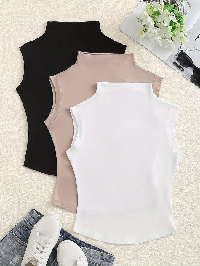 Assorted flat lay of the assorted colors high-neck sleeveless fitted tank top, showing the garment shape and available styling.