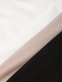 Fabric detail of the assorted colors high-neck sleeveless fitted tank top, showing high neckline, smooth stretch fabric and fitted shape.