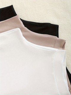 Neckline detail of the assorted colors high-neck sleeveless fitted tank top, showing high neckline, smooth stretch fabric and fitted shape.