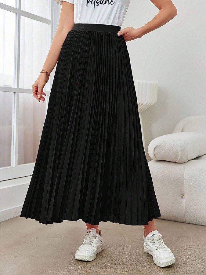 Front view of the black accordion-pleated maxi skirt, showing its silhouette and design details.
