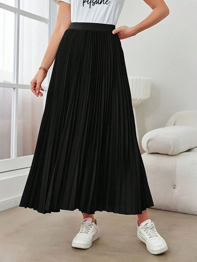 Front view of the black accordion-pleated maxi skirt, showing its silhouette and design details.