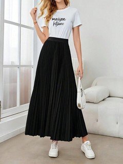 Full-length front view of the black accordion-pleated maxi skirt, showing its silhouette and design details.