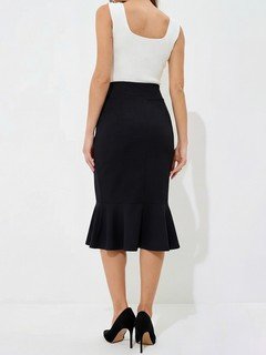 Back view of the black high-waisted fishtail midi skirt, showing its silhouette and design details.