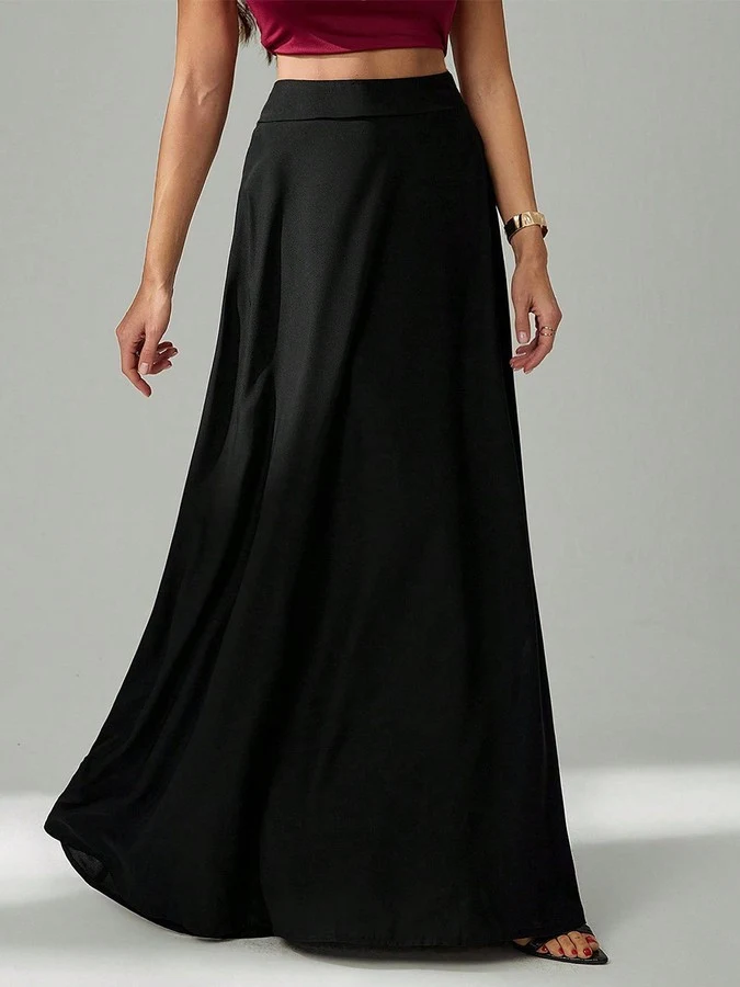 Front view of the black pleated a-line maxi skirt, showing its silhouette and design details.