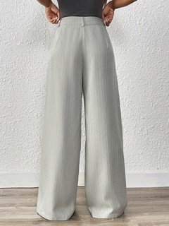 Back view of the light gray pleated wide-leg tailored pants, showing its silhouette and design details.