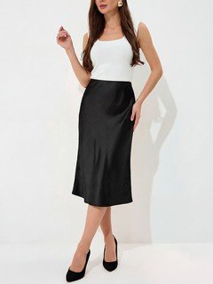 Angled front view of the black satin a-line midi slip skirt, showing its silhouette and design details.