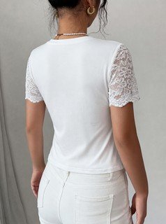 Back view of the white lace-sleeve crew-neck short-sleeve top, showing the silhouette and fit.