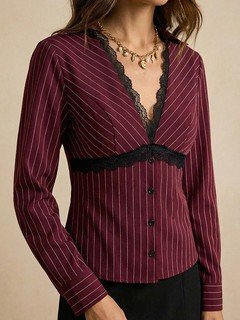 Close-up of the burgundy lace-trim pinstripe blouse, showing its silhouette and design details.