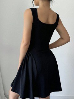 Back view of the black layering square-neck sleeveless skater mini dress, showing the silhouette and fit.
