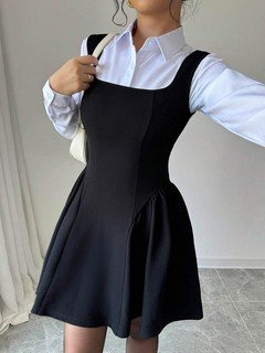 Layered front view of the black layering square-neck sleeveless skater mini dress, showing the silhouette and fit.