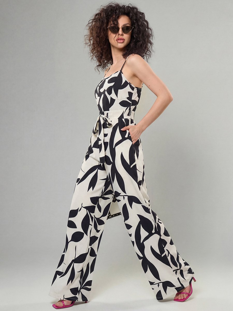 Black And White Leaf Print Wide-Leg Jumpsuit – Front View Front view of the black and white leaf print wide-leg jumpsuit, showing its silhouette and design details.