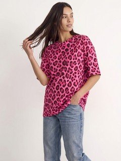 Styled front view of the pink leopard oversized crew-neck tee, showing its silhouette and design details.