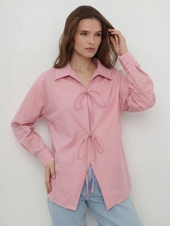 Angled front view of the pink bow-tie front collared shirt, showing its silhouette and design details.