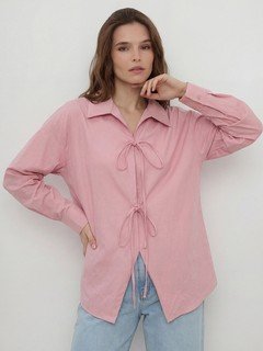 Styled front view of the pink bow-tie front collared shirt, showing its silhouette and design details.