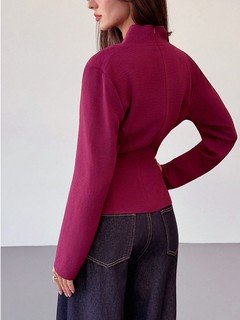Back view of the burgundy draped long-sleeve wrap blouse, showing its silhouette and design details.