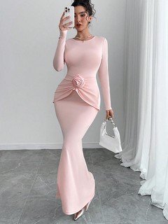Angled front view of the pink rosette-waist fishtail maxi dress, showing its silhouette and design details.