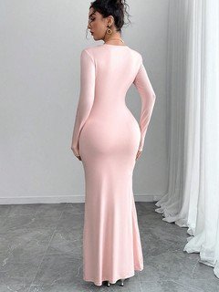 Back view of the pink rosette-waist fishtail maxi dress, showing its silhouette and design details.