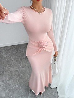 Close-up of the pink rosette-waist fishtail maxi dress, showing its silhouette and design details.