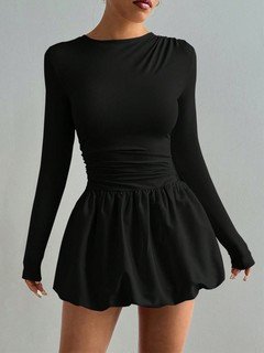 Styled front view of the black long-sleeve bubble hem dress, showing its silhouette and design details.