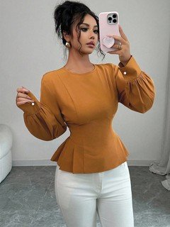 Full-length front view of the ochre tailored long-sleeve peplum blouse, showing its silhouette and design details.