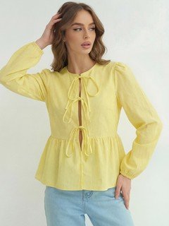Styled front view of the yellow tie-front long-sleeve blouse, showing its silhouette and design details.