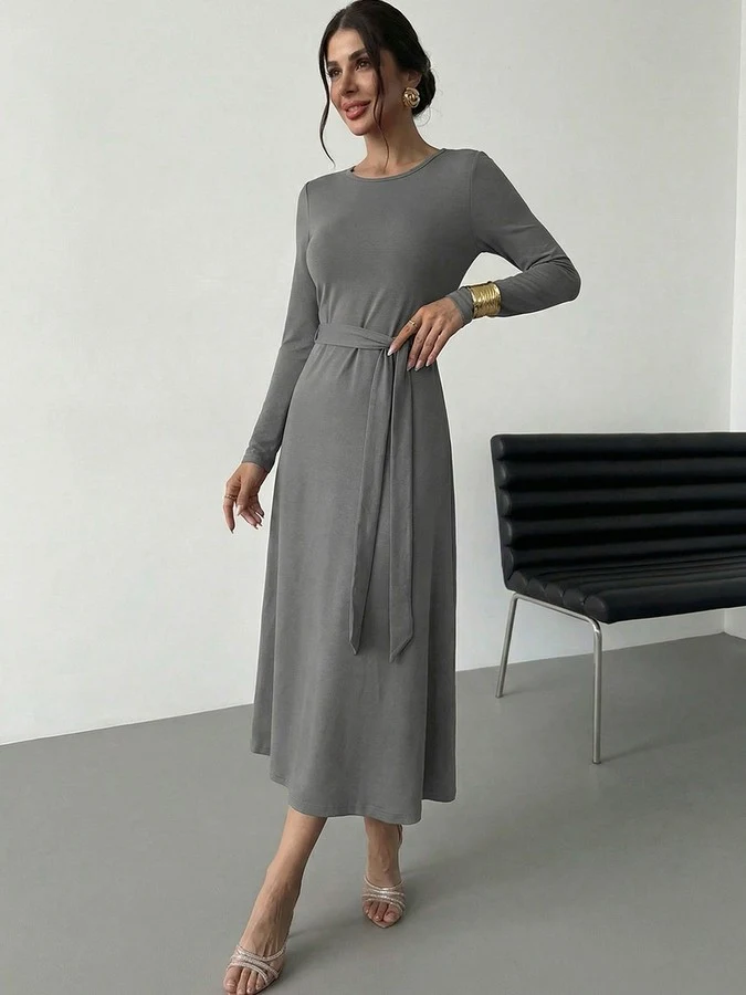 Front view of the gray tie-waist long-sleeve midi dress, showing its silhouette and design details.