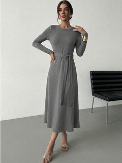 Angled front view of the gray tie-waist long-sleeve midi dress, showing its silhouette and design details.