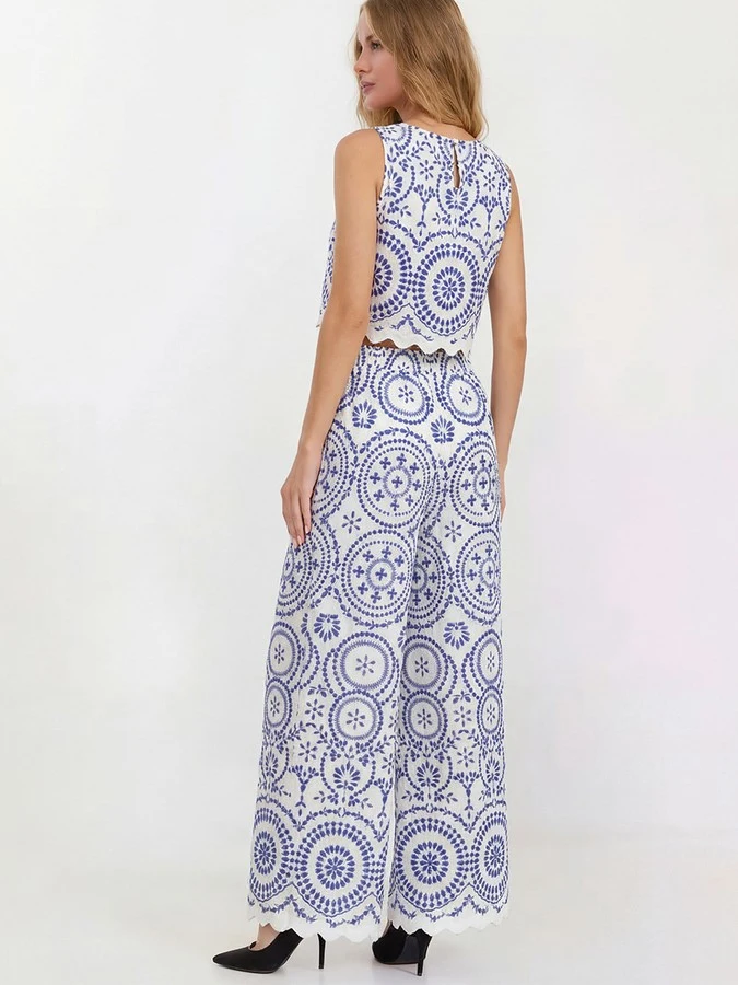 Back view of the blue and white medallion print top and pants set, showing its silhouette and design details.