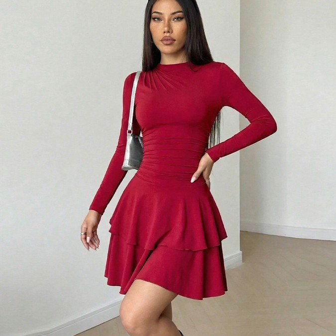 Front view of the red long-sleeve tiered ruffle dress, showing its silhouette and design details.