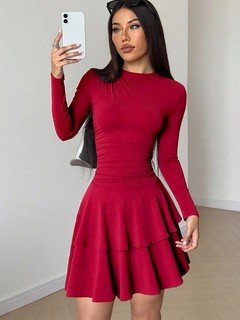 Styled front view of the red long-sleeve tiered ruffle dress, showing its silhouette and design details.