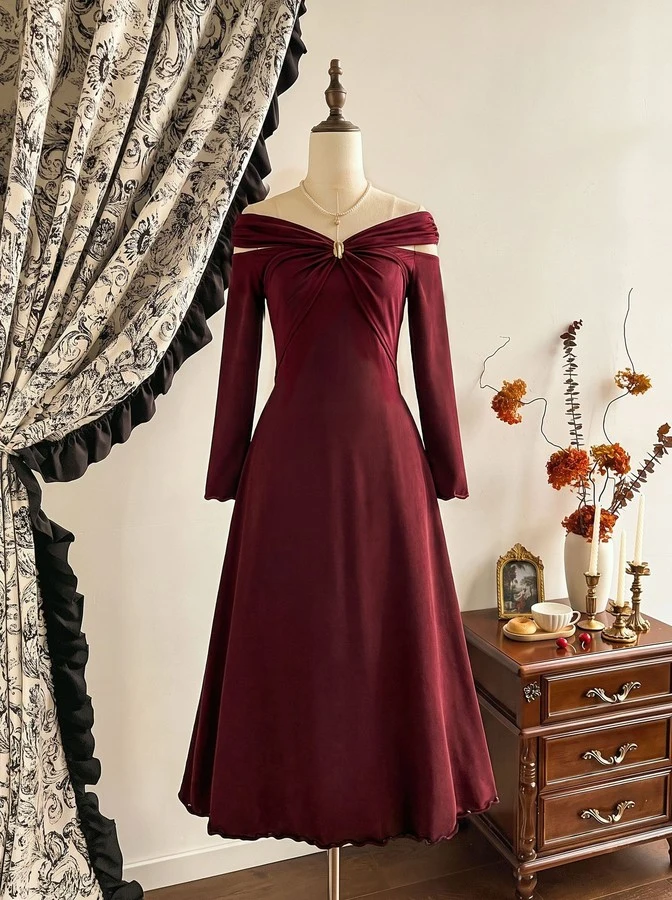 Mannequin front view of the burgundy off-shoulder pleated a-line midi dress, showing the silhouette and fit.