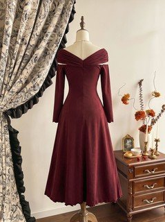 Mannequin back view of the burgundy off-shoulder pleated a-line midi dress, showing the silhouette and fit.