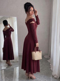 Model front view of the burgundy off-shoulder pleated a-line midi dress, showing the silhouette and fit.