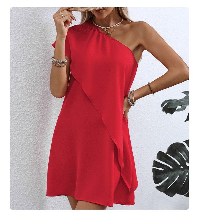 Front view of the red one-shoulder overlay mini dress, showing its silhouette and design details.