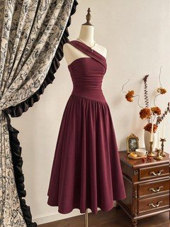 Mannequin front view of the burgundy one-shoulder pleated a-line midi dress, showing the silhouette and fit.