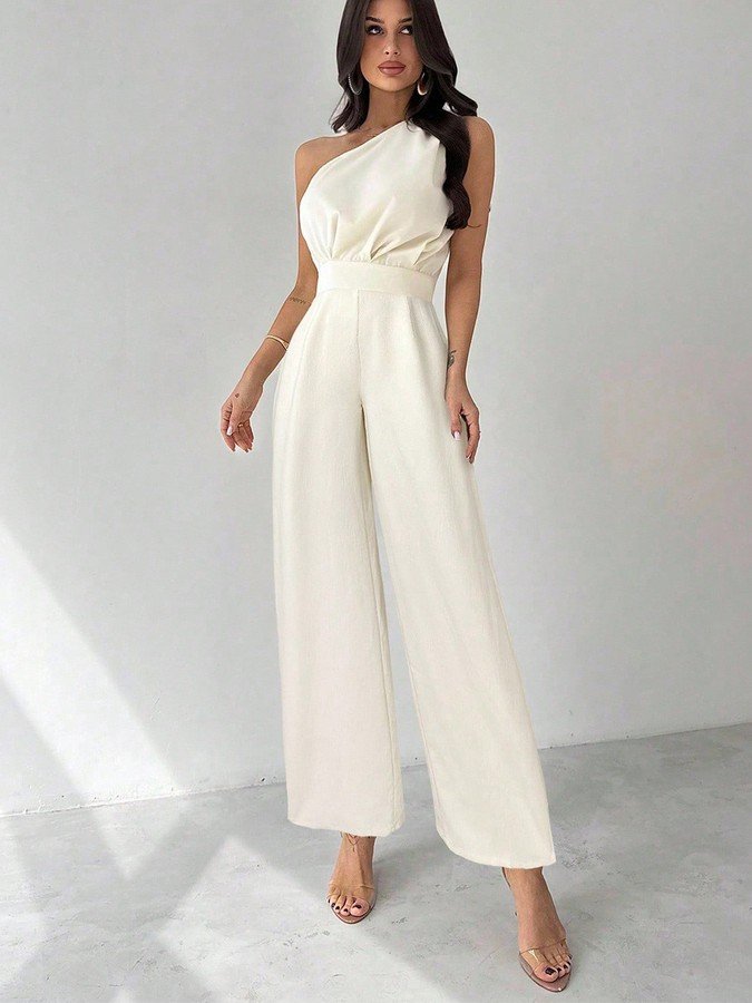 Front view of the ivory one-shoulder tie-waist wide-leg jumpsuit, showing the silhouette and fit.