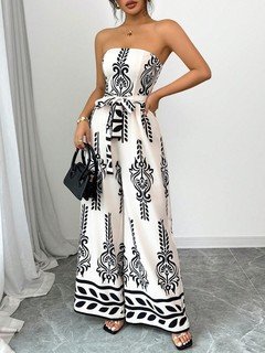 Front view of the white and black ornamental strapless jumpsuit, showing its silhouette and design details.