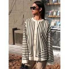 Alternate front view of the cream and black striped border hem shirt, showing its silhouette and design details.