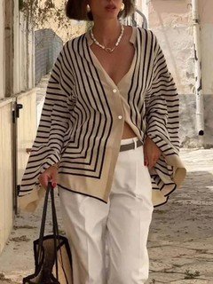 Studio front view of the cream and black striped border hem shirt, showing its silhouette and design details.