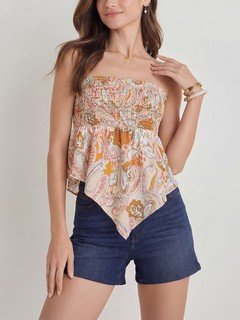Angled front view of the cream paisley smocked strapless top, showing its silhouette and design details.