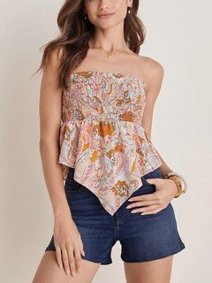 Front view of the cream paisley smocked strapless top, showing its silhouette and design details.