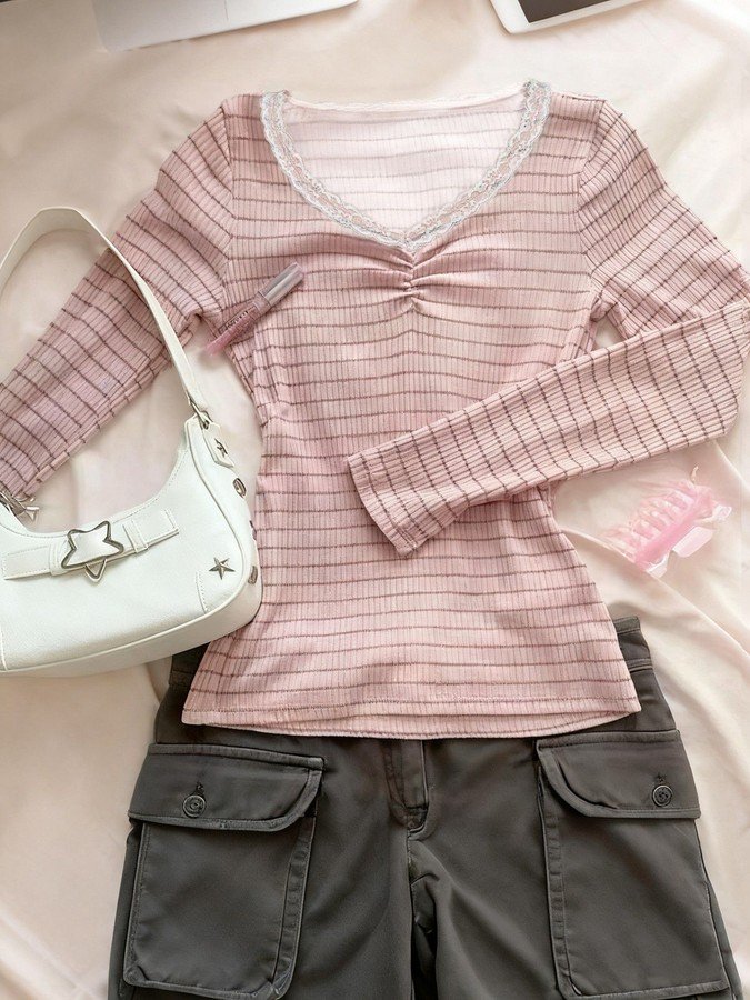 Flat lay of the pink pink striped lace-trim v-neck long-sleeve top, showing the garment shape and available styling.