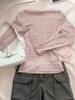 Styled flat lay of the pink pink striped lace-trim v-neck long-sleeve top, showing the garment shape and available styling.