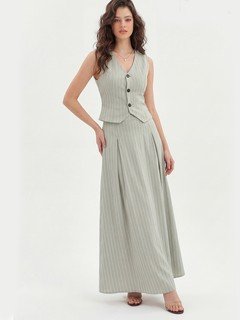 Lifestyle front view of the light gray pinstripe vest and maxi skirt set, showing its silhouette and design details.