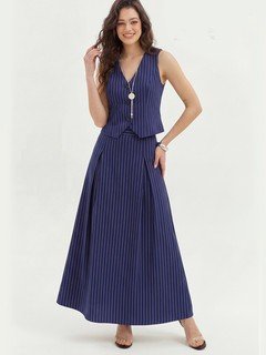 Front fit view of the navy pinstripe vest and maxi skirt set, showing its silhouette and design details.